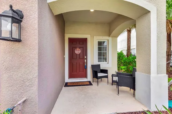 a view of a livingroom with furniture and a window