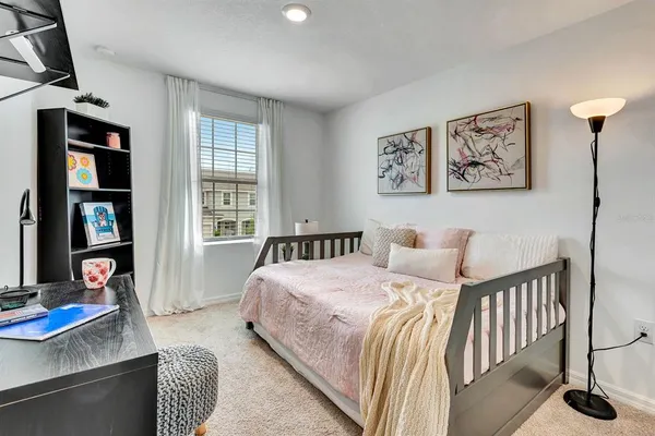 a bedroom with a bed and a table