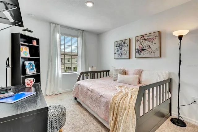 a bedroom with a bed and a table