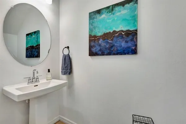 a bathroom with a sink and a mirror