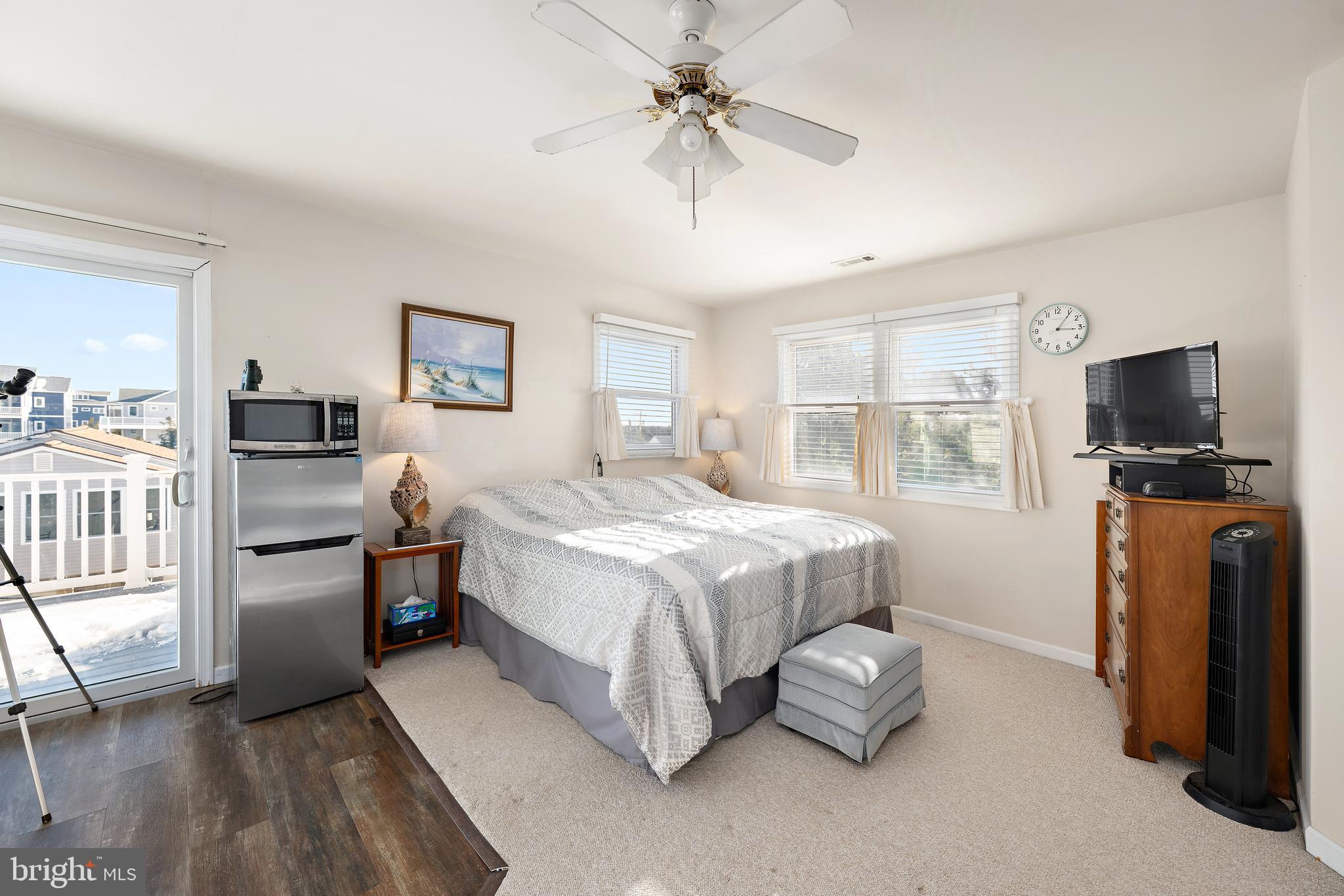 8 Virginia Avenue Milton, DE 19968 - Photo 22 of 50 a spacious bedroom with a bed and a flat screen tv