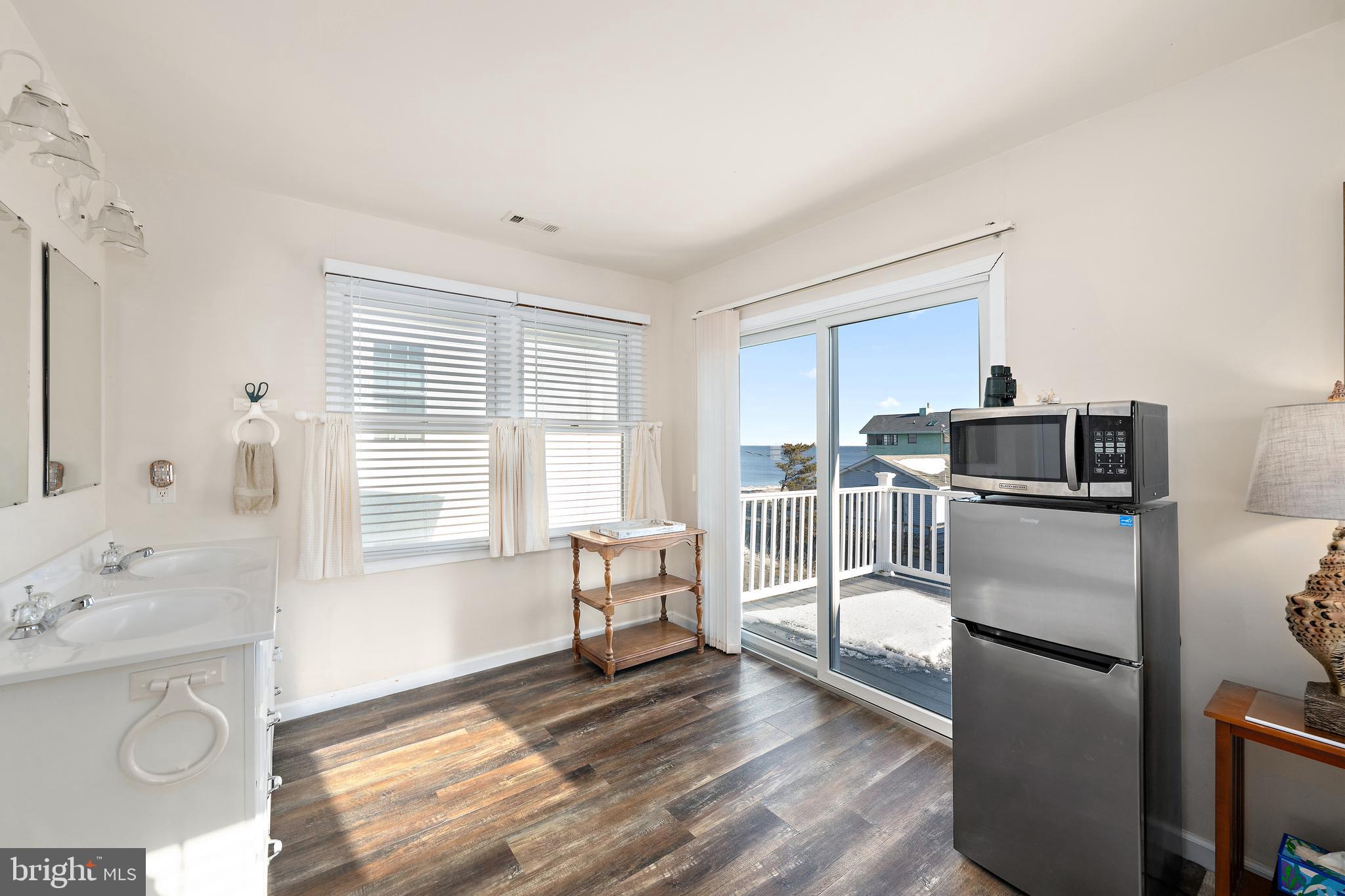 8 Virginia Avenue Milton, DE 19968 - Photo 26 of 50 a kitchen with granite countertop a refrigerator and a sink