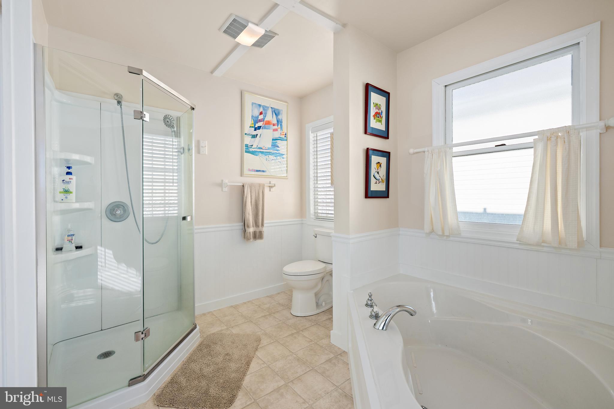8 Virginia Avenue Milton, DE 19968 - Photo 29 of 50 a bathroom with a granite countertop shower a toilet and a sink