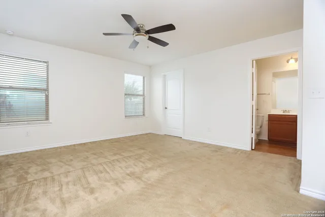 an empty room with a empty space and windows