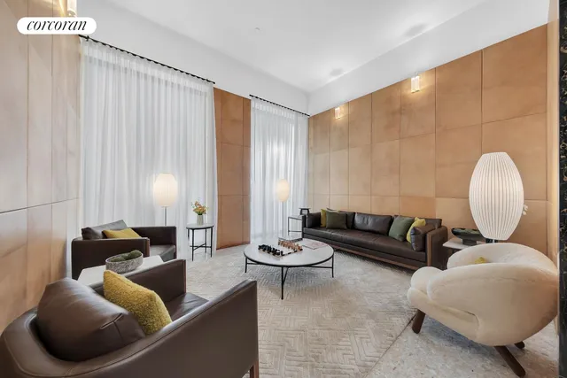 a view of a patio with couches table and chairs and potted plants