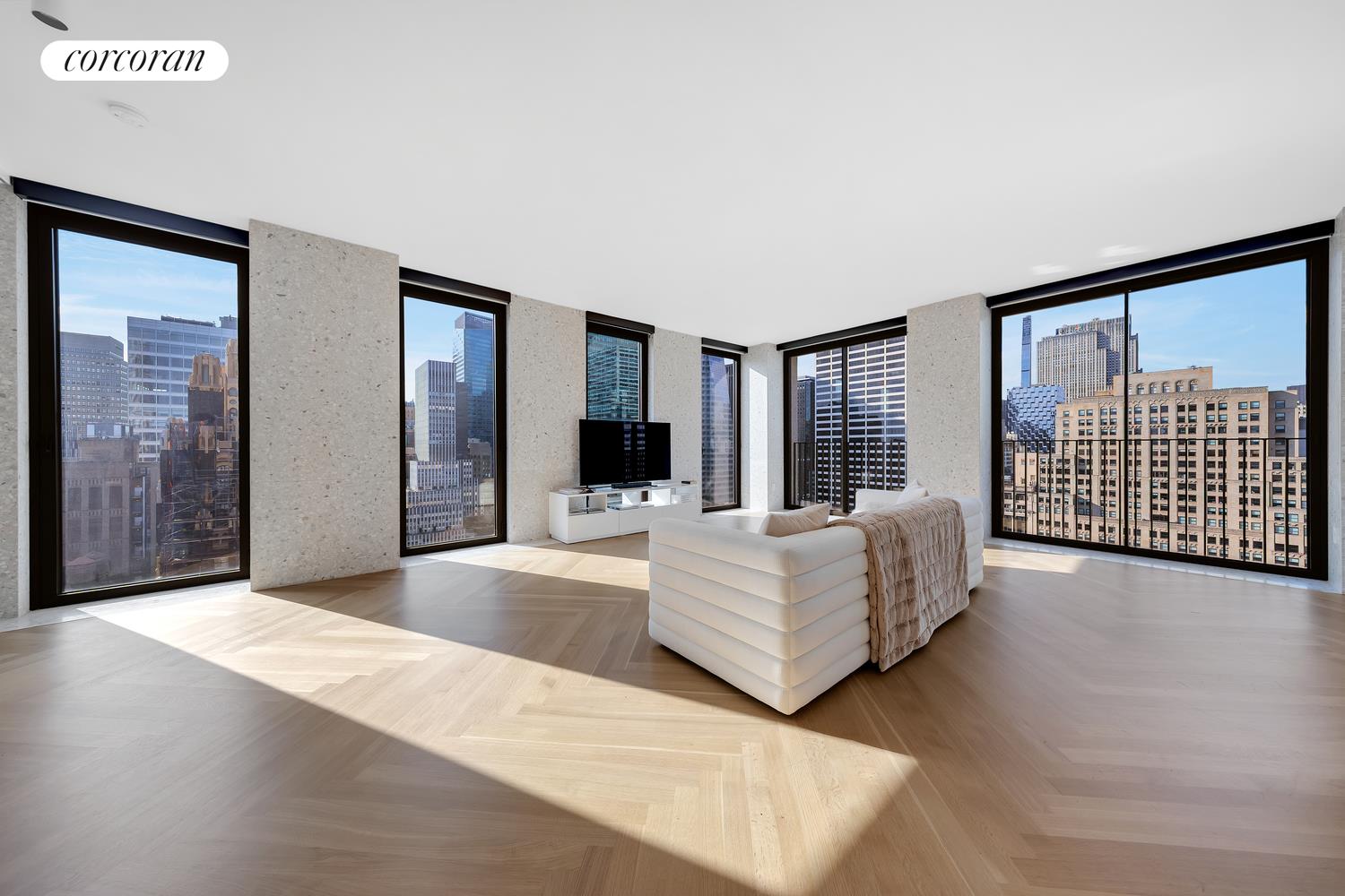 a living room with furniture large window and flat screen tv