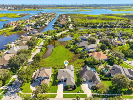 a view of yard with swimming pool and green space