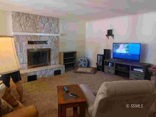 421 South Valley Street Ridgecrest, CA 93555 - Photo 3 of 20 a living room with furniture and a fireplace