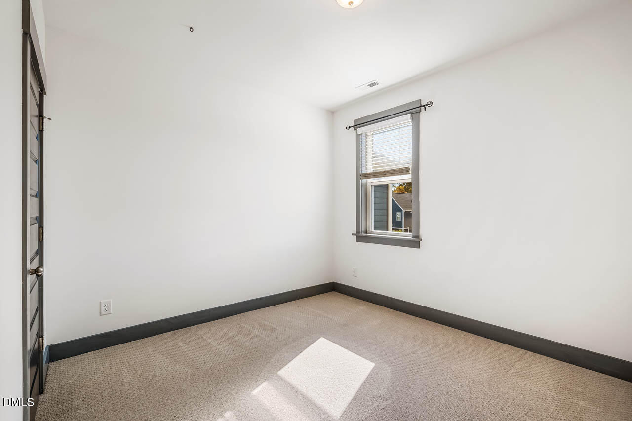 260 Quarter Gate Trace Chapel Hill, NC 27516 - Photo 28 of 68 a view of an empty room with a window