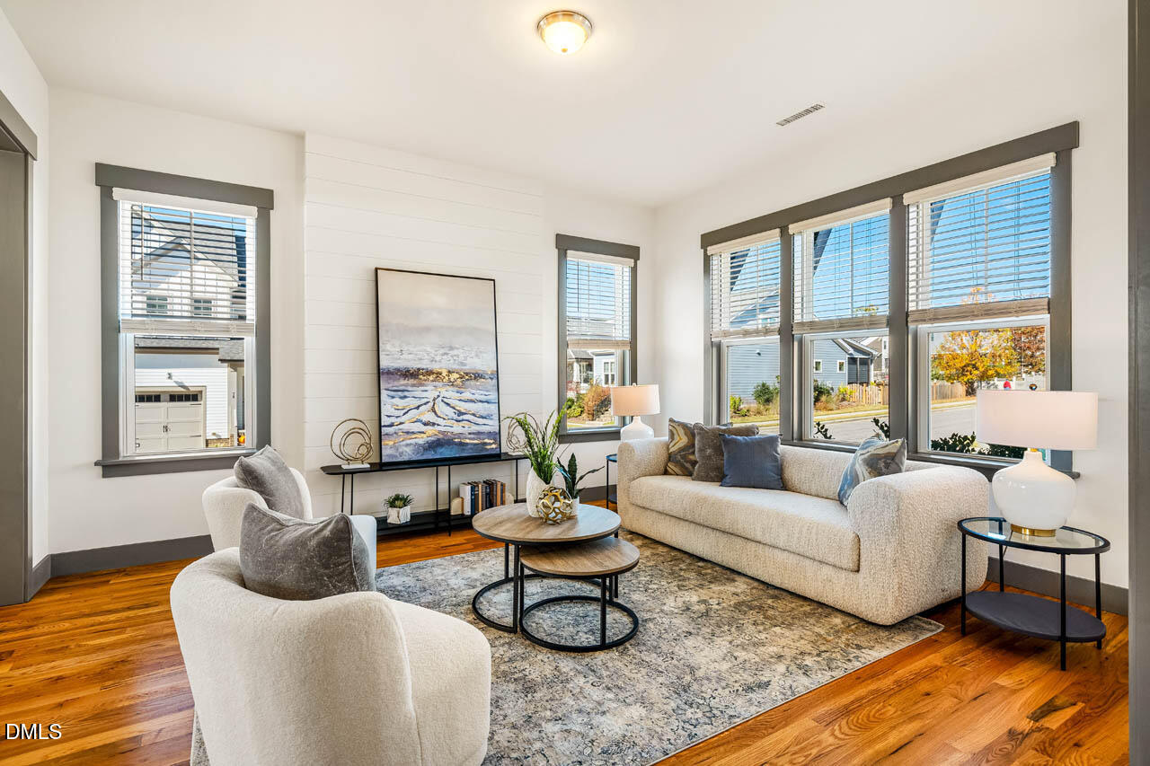 260 Quarter Gate Trace Chapel Hill, NC 27516 - Photo 6 of 68 a living room with furniture and floor to ceiling windows