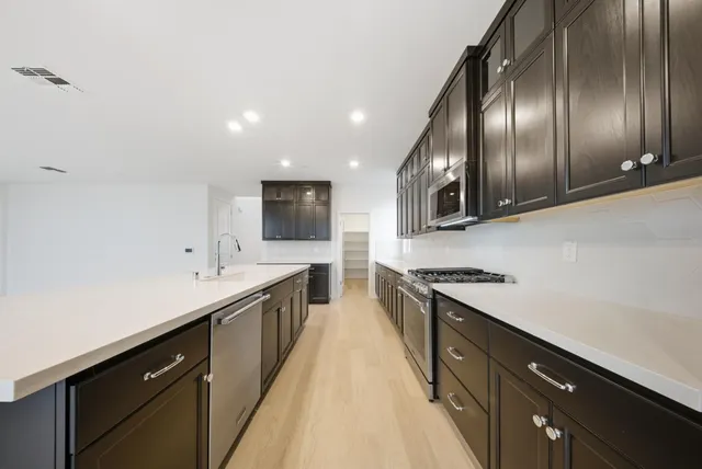 an empty room with a empty space and windows