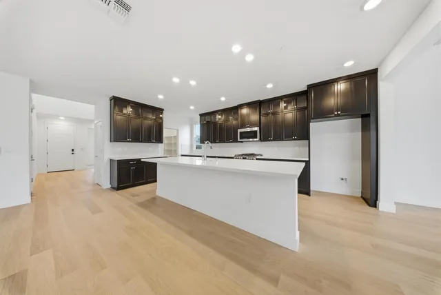 a view of kitchen appliances and a microwave