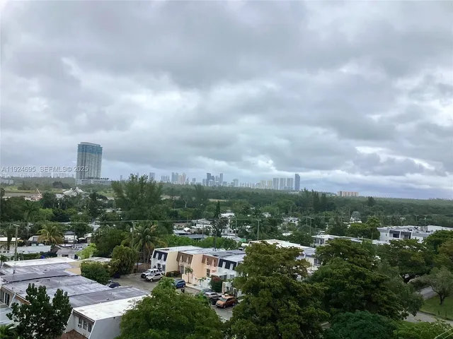 an empty room with wooden floor
