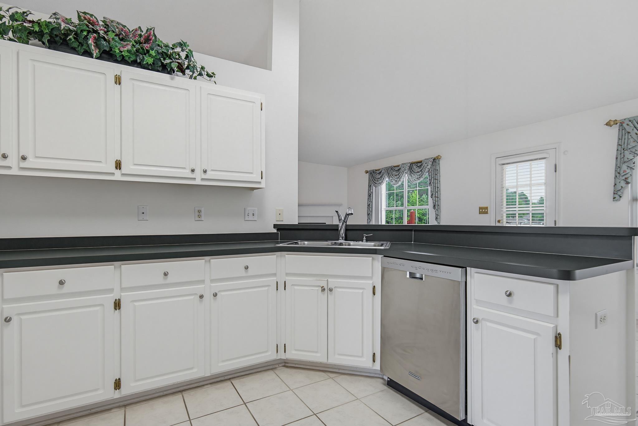 2856 Atoka Trail Crestview, FL 32539 - Photo 18 of 53 a kitchen with granite countertop white cabinets and a sink