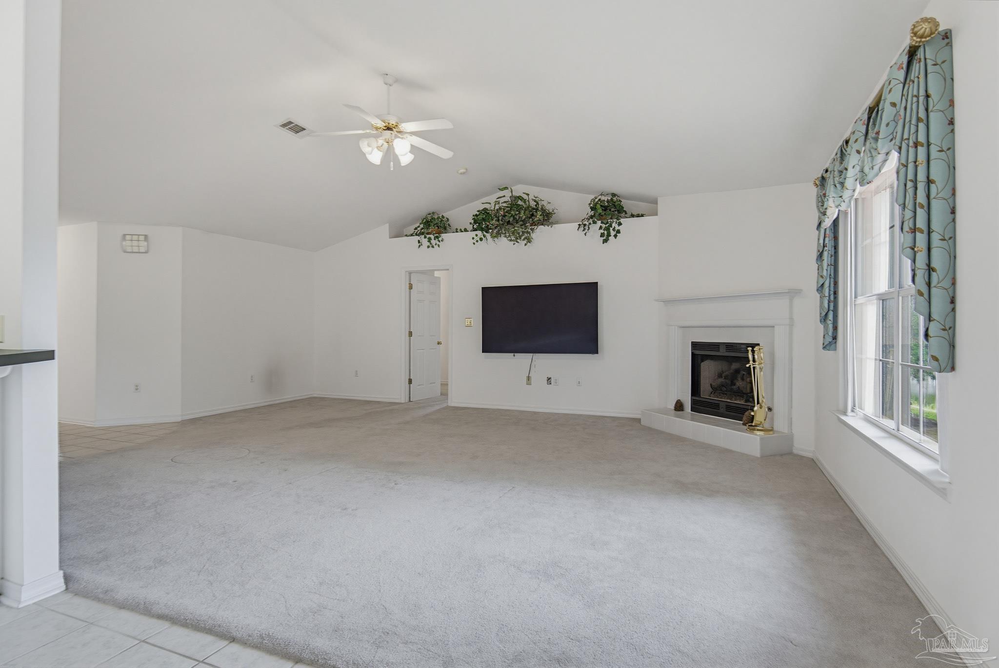 2856 Atoka Trail Crestview, FL 32539 - Photo 23 of 53 wooden floor in an empty room with a fireplace