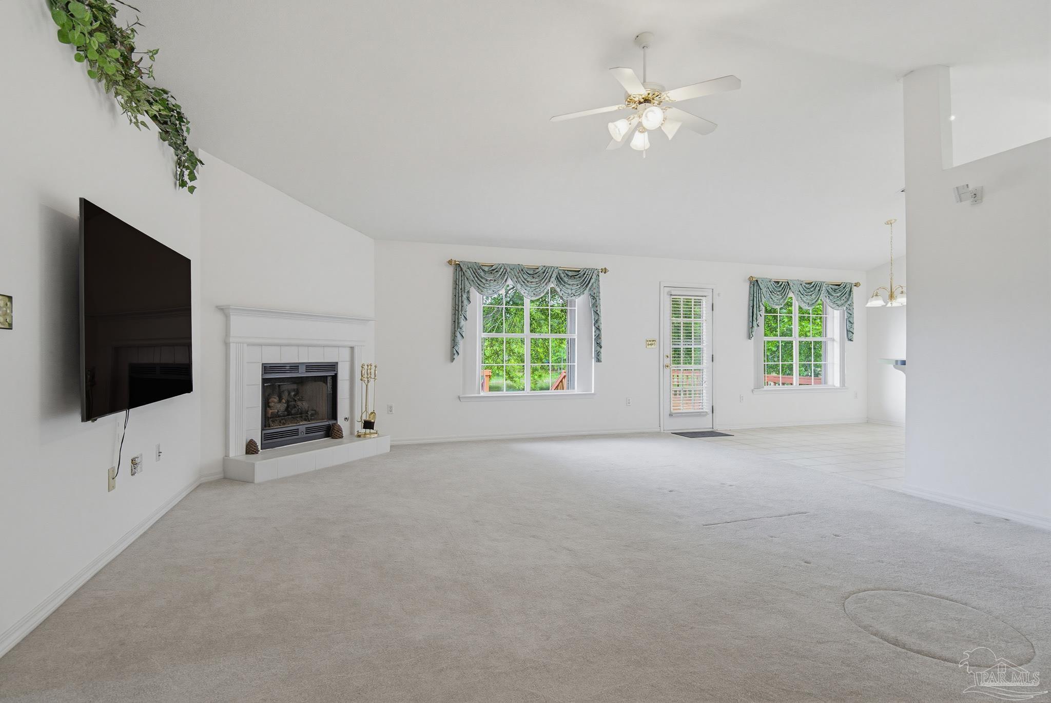 2856 Atoka Trail Crestview, FL 32539 - Photo 25 of 53 en empty room with windows and fireplace