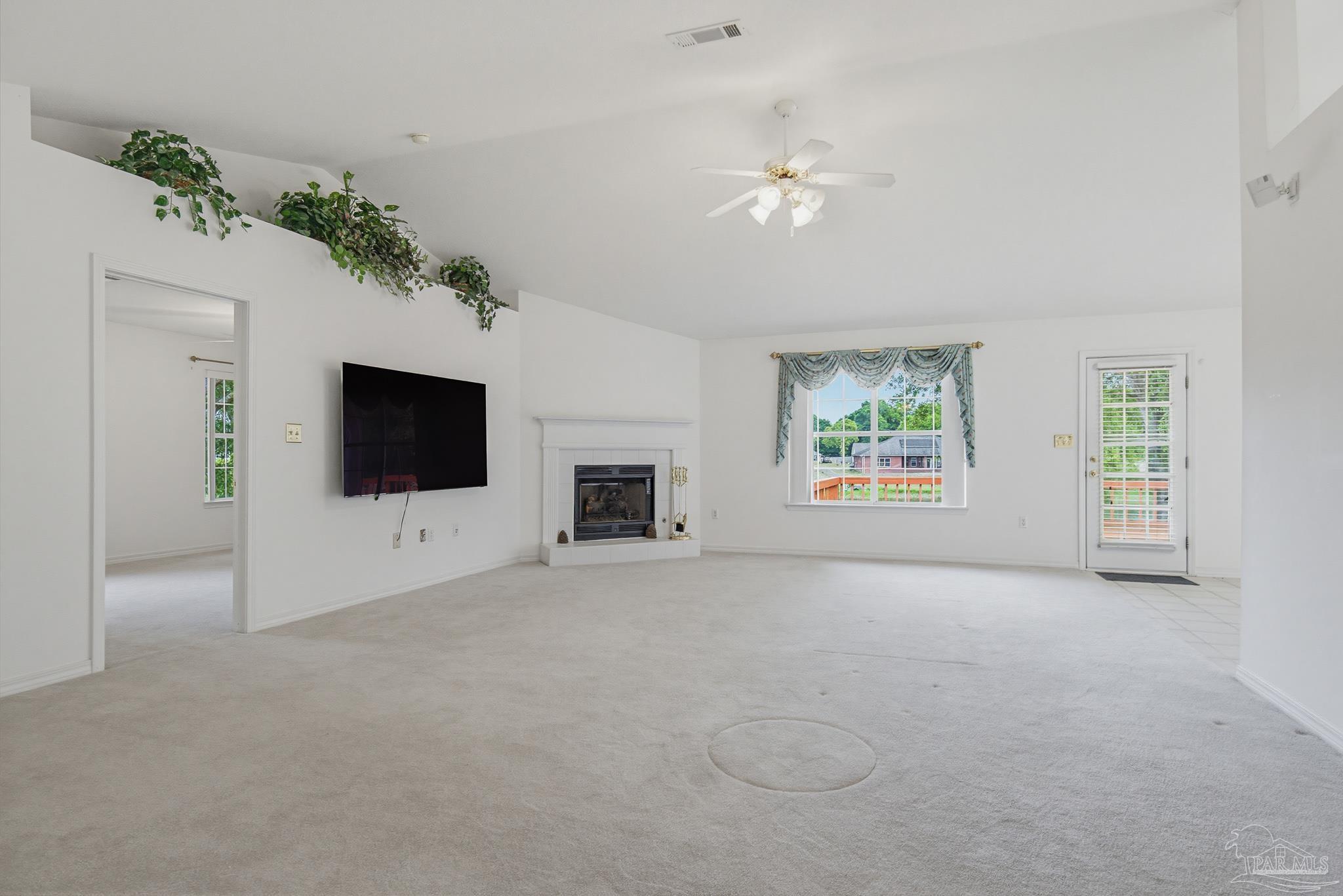 2856 Atoka Trail Crestview, FL 32539 - Photo 26 of 53 an empty room with windows and fireplace