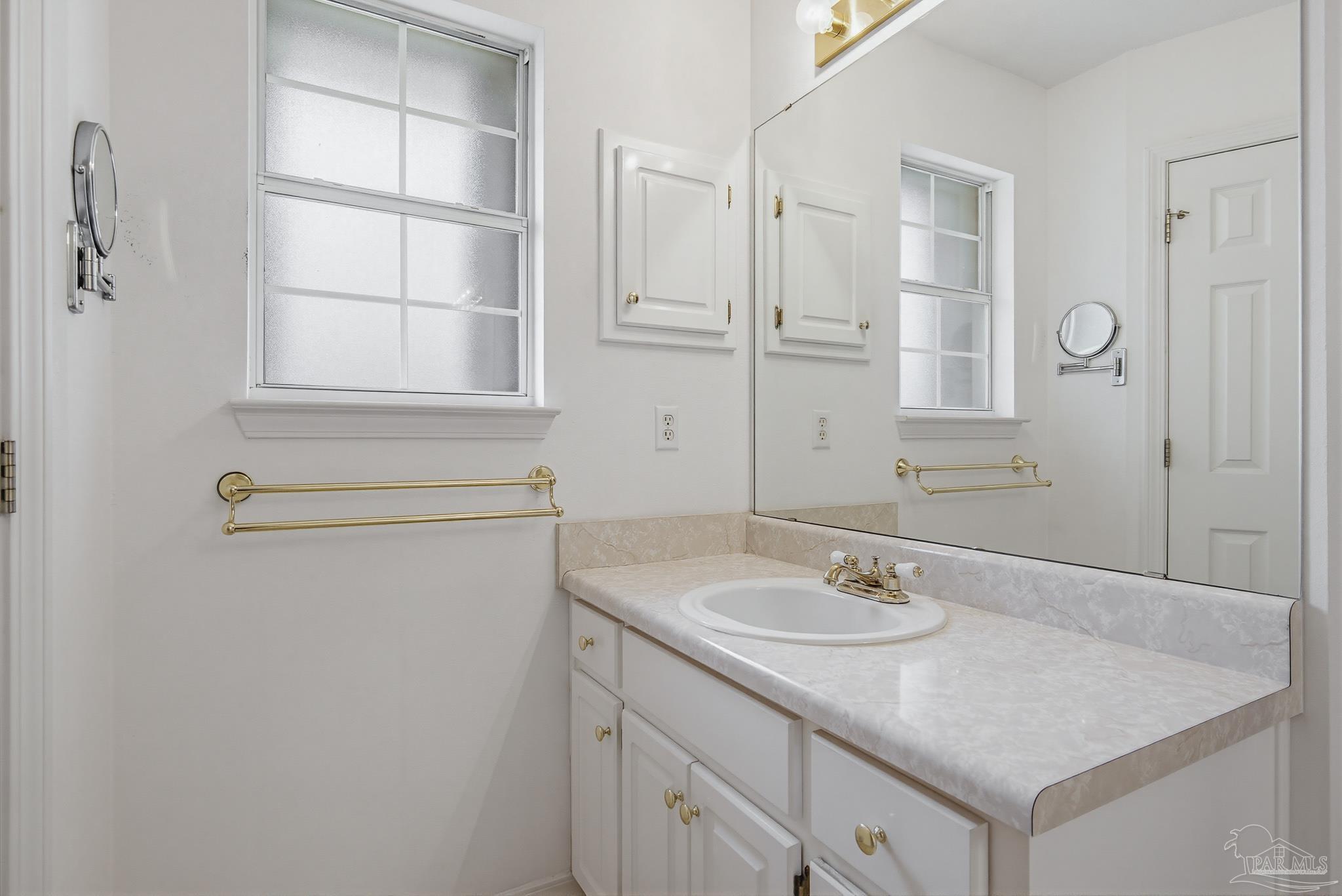 2856 Atoka Trail Crestview, FL 32539 - Photo 36 of 53 a bathroom with a sink and a mirror