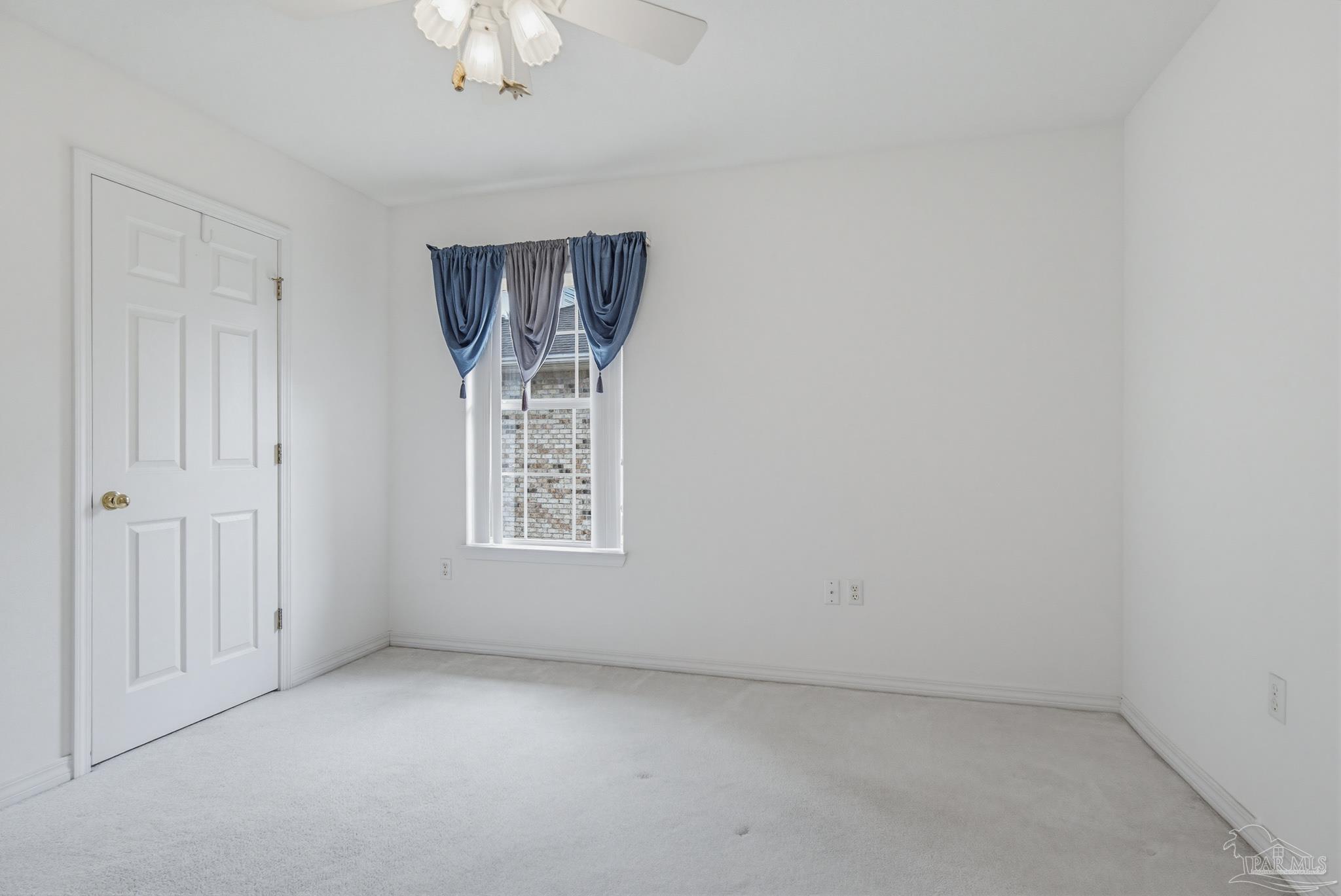 2856 Atoka Trail Crestview, FL 32539 - Photo 44 of 53 an empty room with chandelier fan