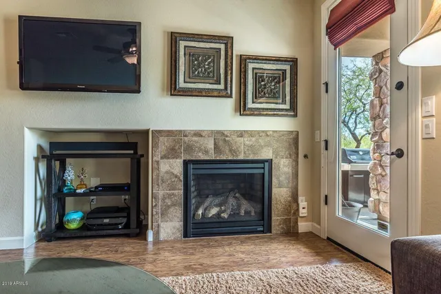 a living room with furniture and a fireplace