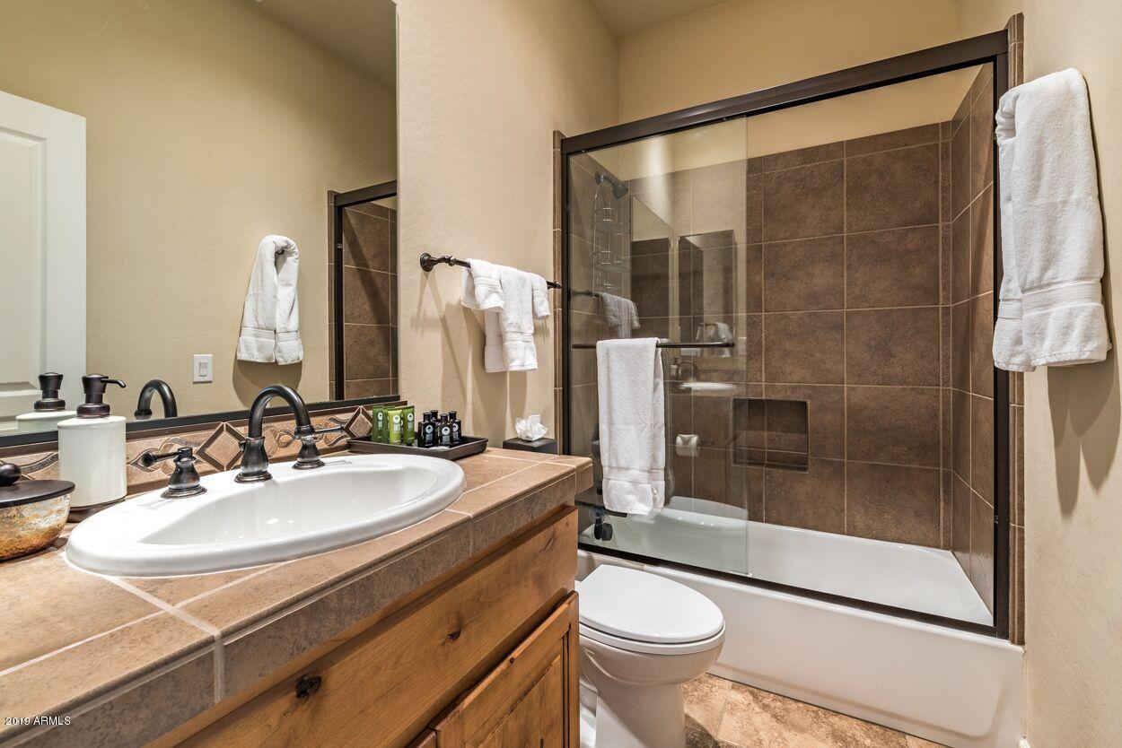 20750 North 87th Street, Unit 1123 Scottsdale, AZ 85255 - Photo 16 of 32 a bathroom with a sink toilet and shower