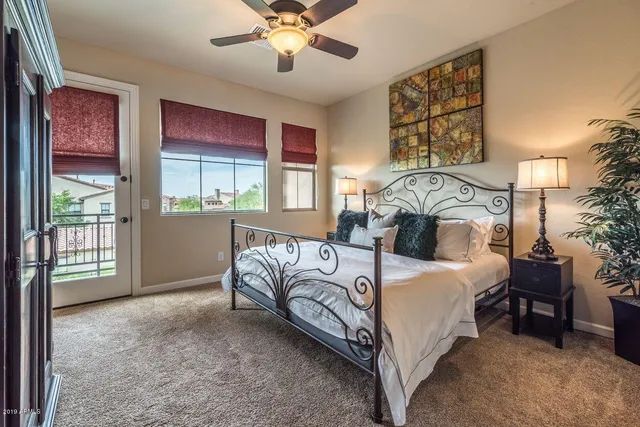 a bed room with a bed and a chandelier