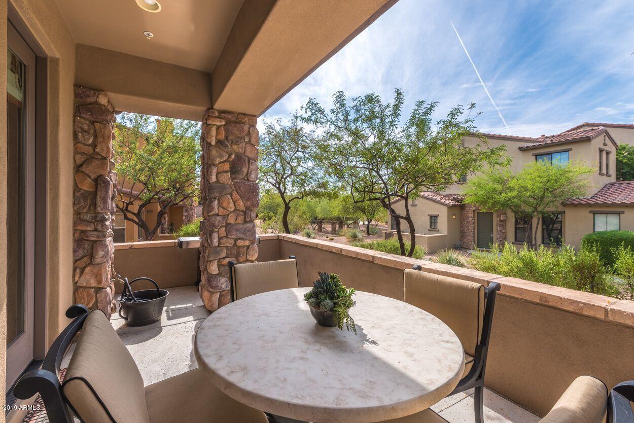 20750 North 87th Street, Unit 1123 Scottsdale, AZ 85255 - Photo 22 of 32 a view of a chairs and table in patio