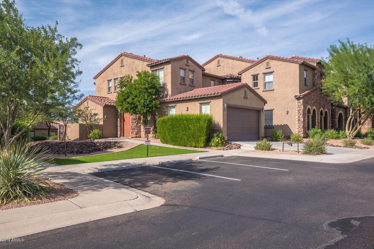 20750 North 87th Street, Unit 1123 Scottsdale, AZ 85255 - Photo 26 of 32 a view of a white house with a big yard and potted plants