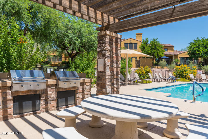 20750 North 87th Street, Unit 1123 Scottsdale, AZ 85255 - Photo 30 of 32 a view of house and outdoor space with swimming pool