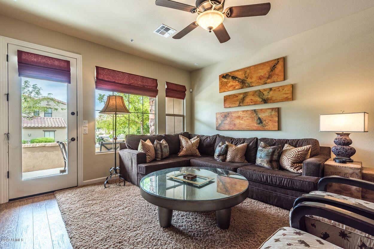 20750 North 87th Street, Unit 1123 Scottsdale, AZ 85255 - Photo 4 of 32 a living room with furniture and a window