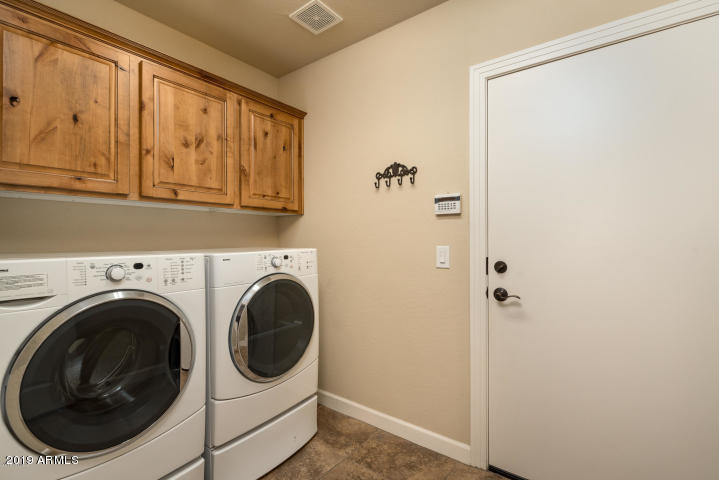 20750 North 87th Street, Unit 1123 Scottsdale, AZ 85255 - Photo 10 of 32 a utility room with dryer and washer