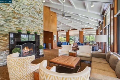 a reading room with furniture and wooden floor