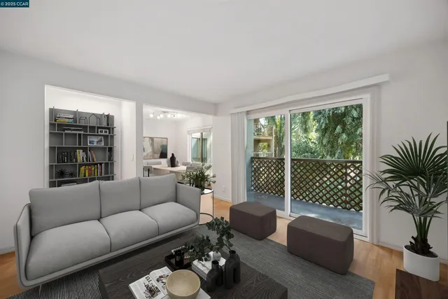 a living room with furniture and a floor to ceiling window