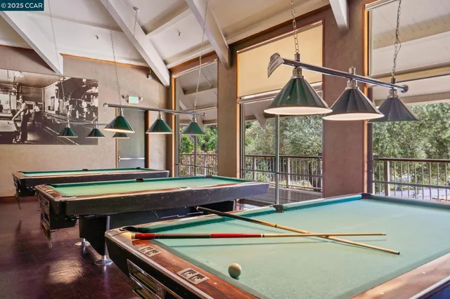 a view of a patio with plants and a fountain