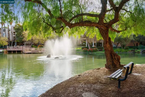 a view of a street with a building on the roadside