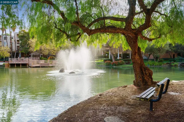 a view of a street with a building on the roadside