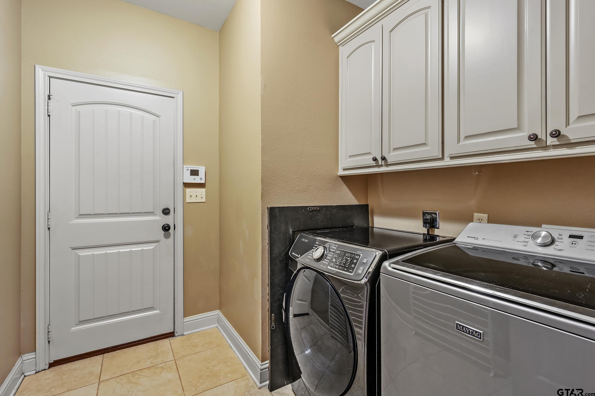 3056 Cornerstone Trail Tyler, TX 75701 - Photo 20 of 24 a utility room with dryer and washer