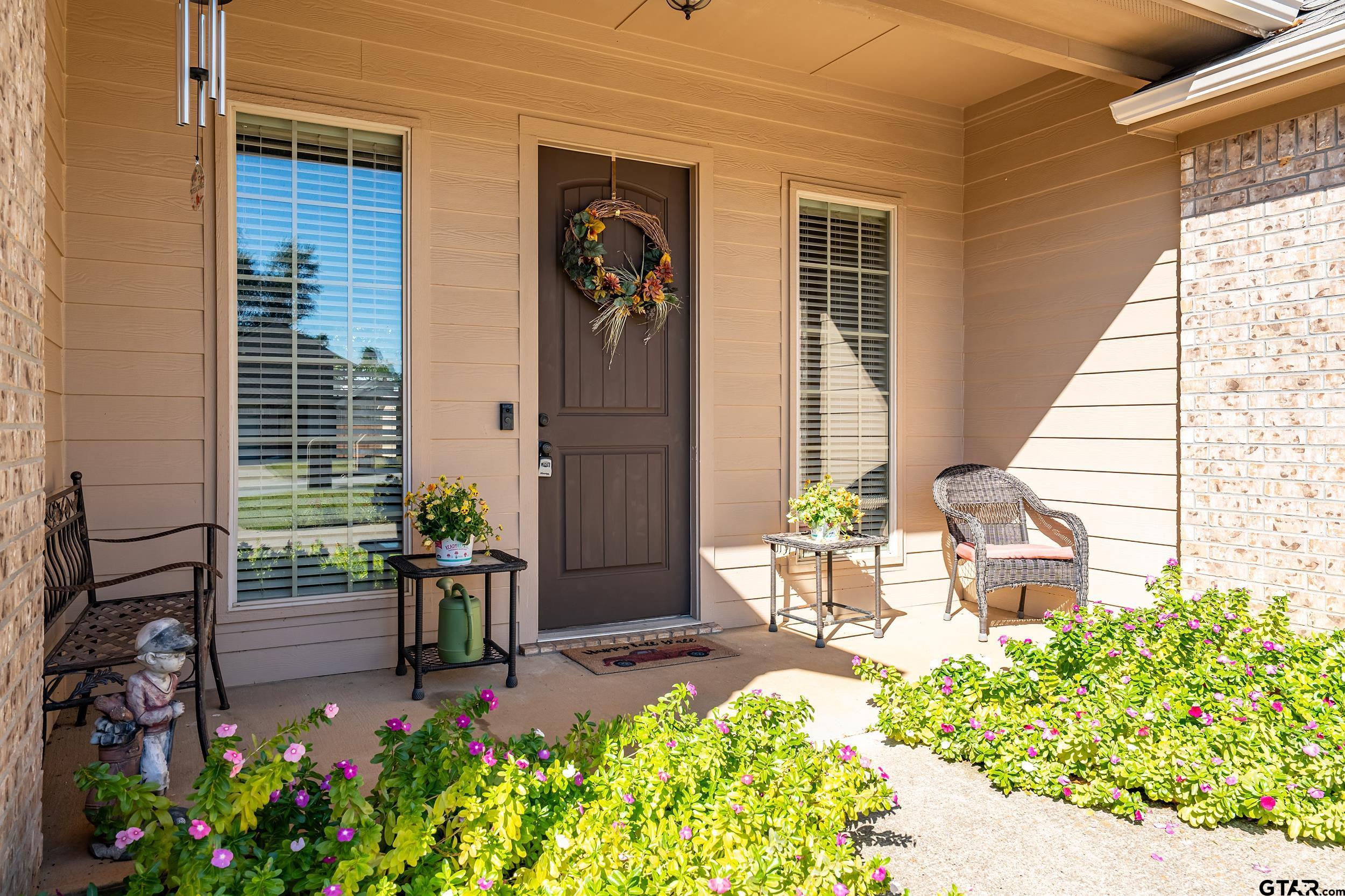 3056 Cornerstone Trail Tyler, TX 75701 - Photo 2 of 24 a front view of a house with a garden