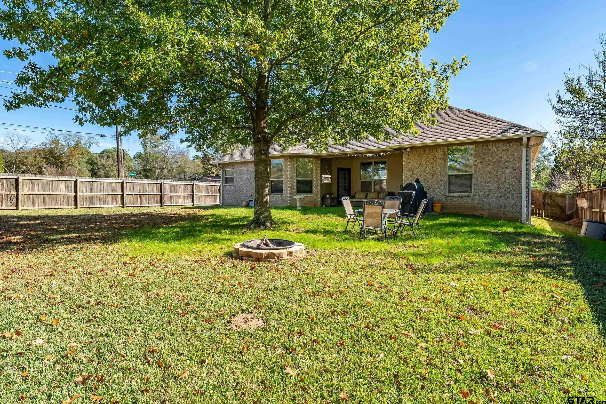 3056 Cornerstone Trail Tyler, TX 75701 - Photo 23 of 24 a view of a house with backyard and a tree