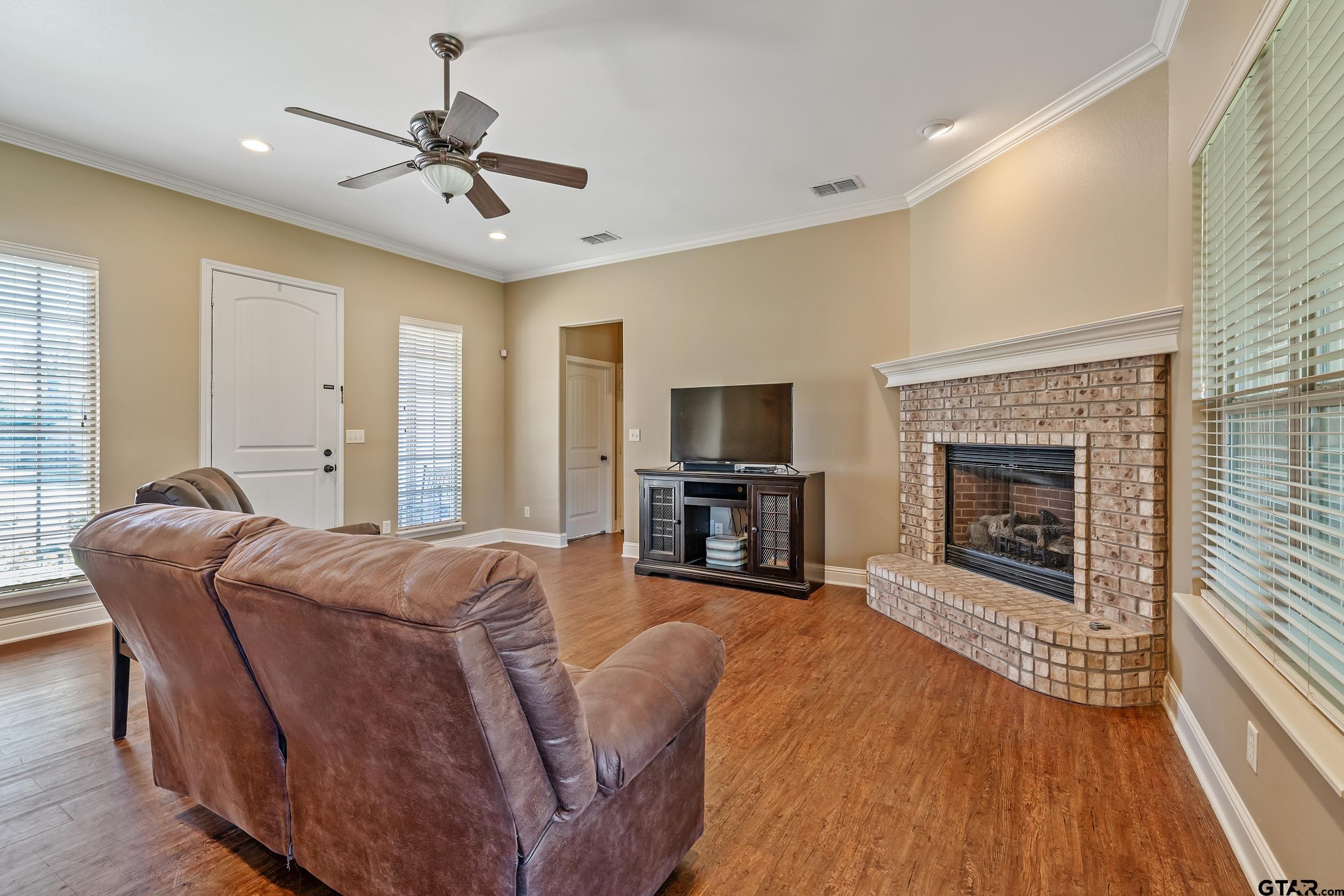 3056 Cornerstone Trail Tyler, TX 75701 - Photo 3 of 24 a living room with furniture and a fireplace