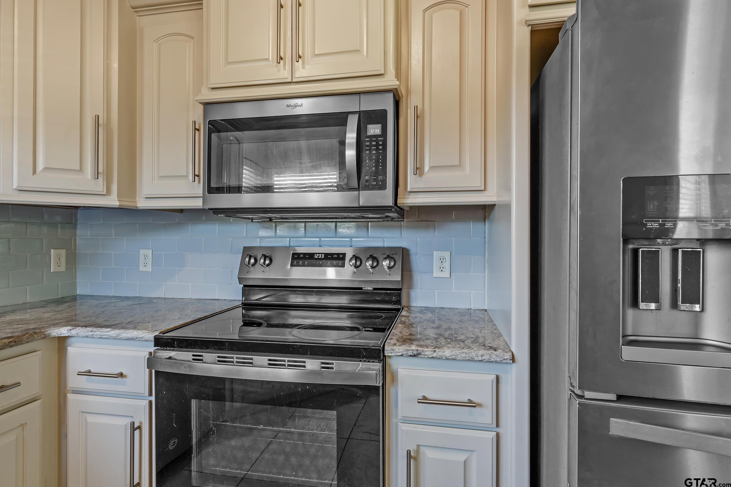 3056 Cornerstone Trail Tyler, TX 75701 - Photo 8 of 24 a stove top oven sitting inside of a kitchen