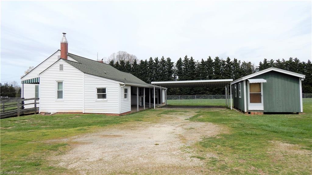 6719 Coltrane Mill Road Greensboro, NC 27406 - Photo 2 of 26 Double covered carport & 24.6 x 12. 3 bldg with electricity!