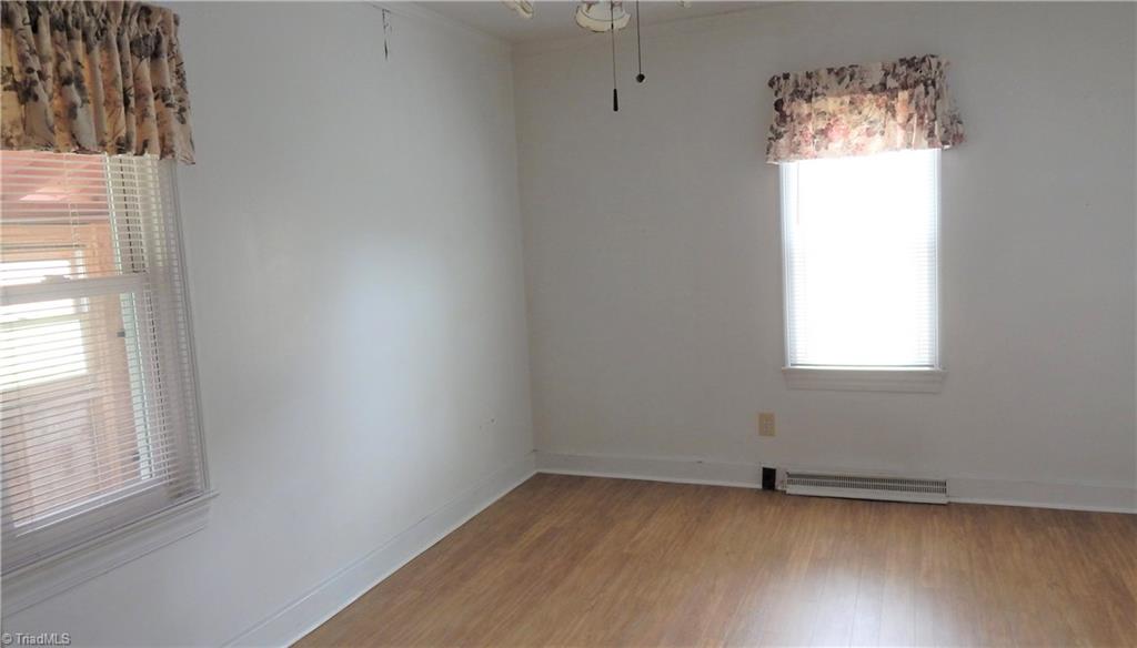 6719 Coltrane Mill Road Greensboro, NC 27406 - Photo 17 of 26 Room which opens to hall (w/closet access), the renovated Bath & exterior door to handicapped ramp! No closet, but was used as a Bedroom!