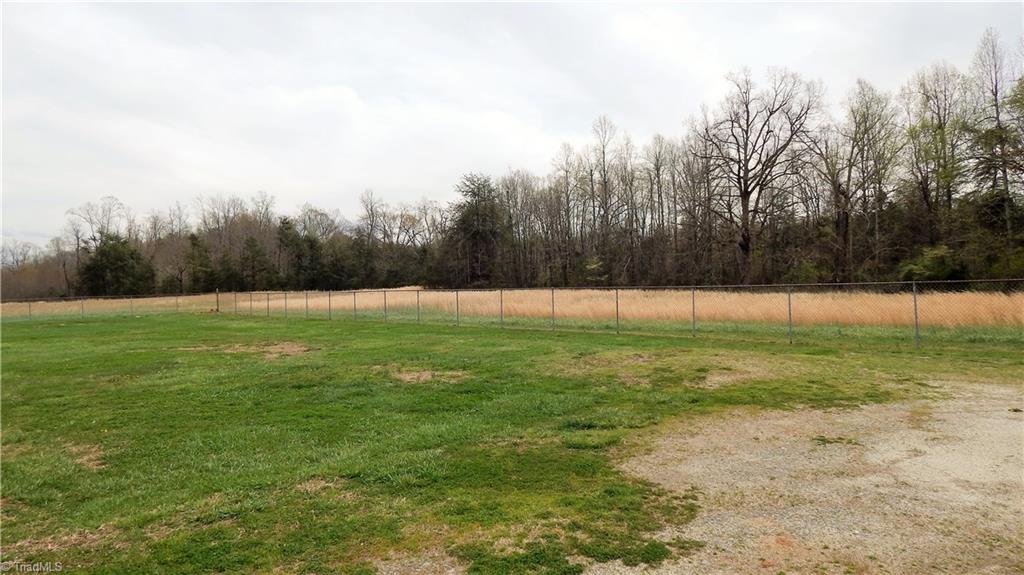 6719 Coltrane Mill Road Greensboro, NC 27406 - Photo 4 of 26 Fenced Acre! This is a rear right view!