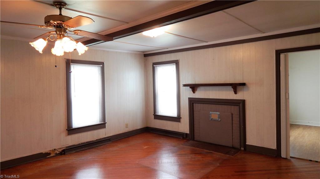 6719 Coltrane Mill Road Greensboro, NC 27406 - Photo 7 of 26 Front Great Room w/ceiling fan & pine hardwood floors!