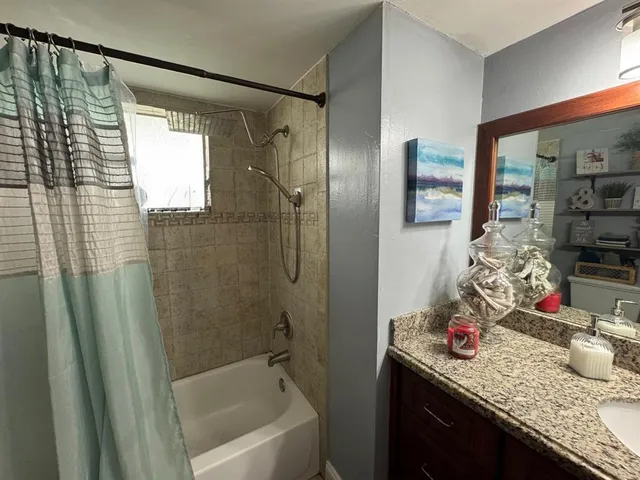 a bathroom with a sink toilet and a mirror