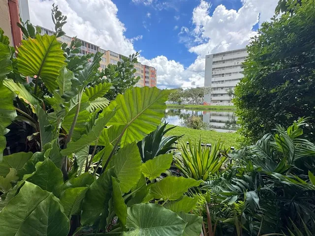 a view of balcony with wooden floor and fence