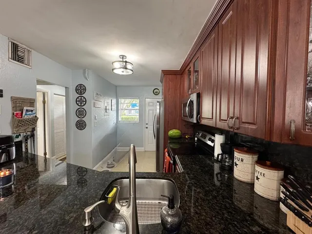 a view of a chairs and table in a kitchen