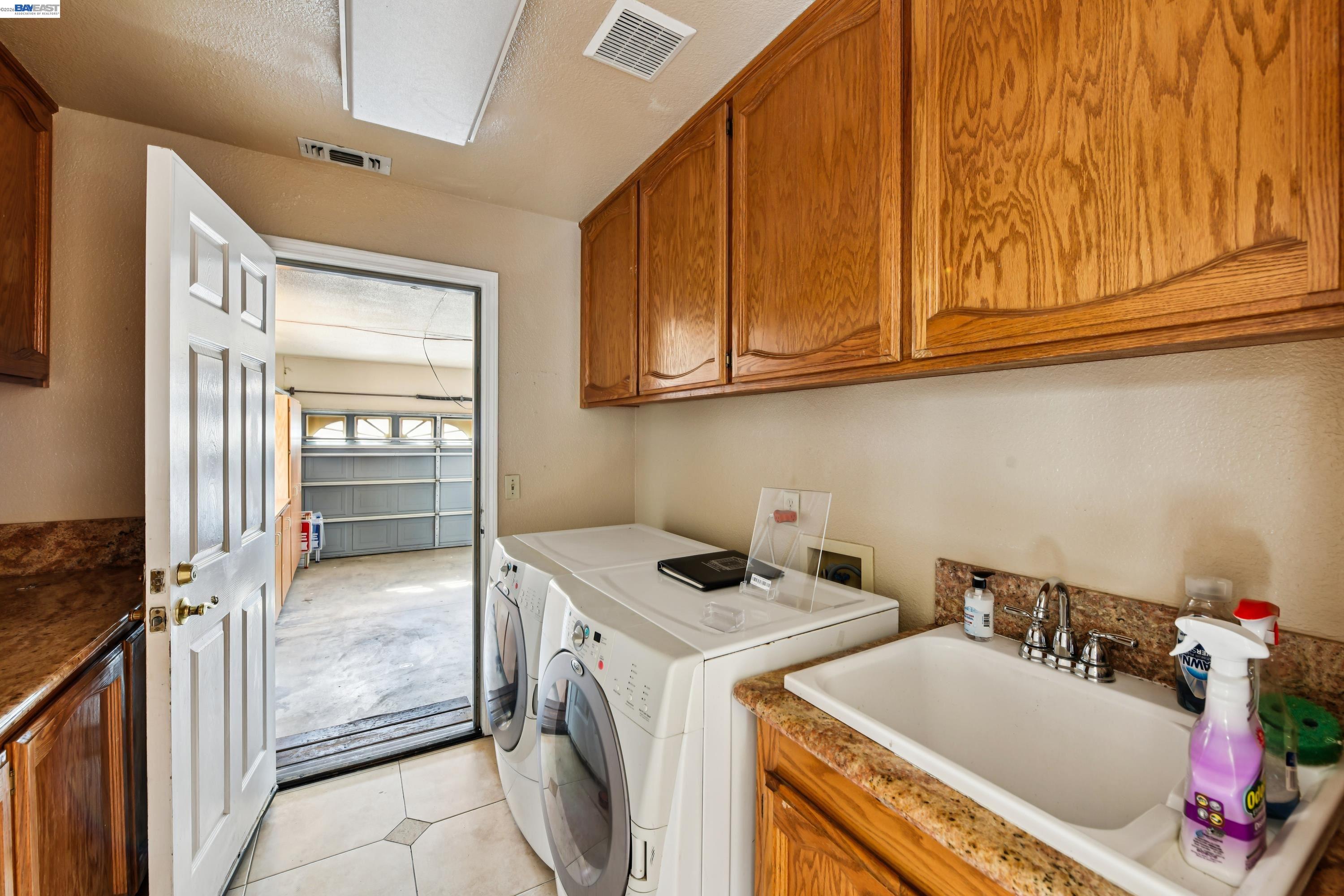 110 Conductor Way Folsom, CA 95630 - Photo 12 of 27 a utility room with dryer and washer