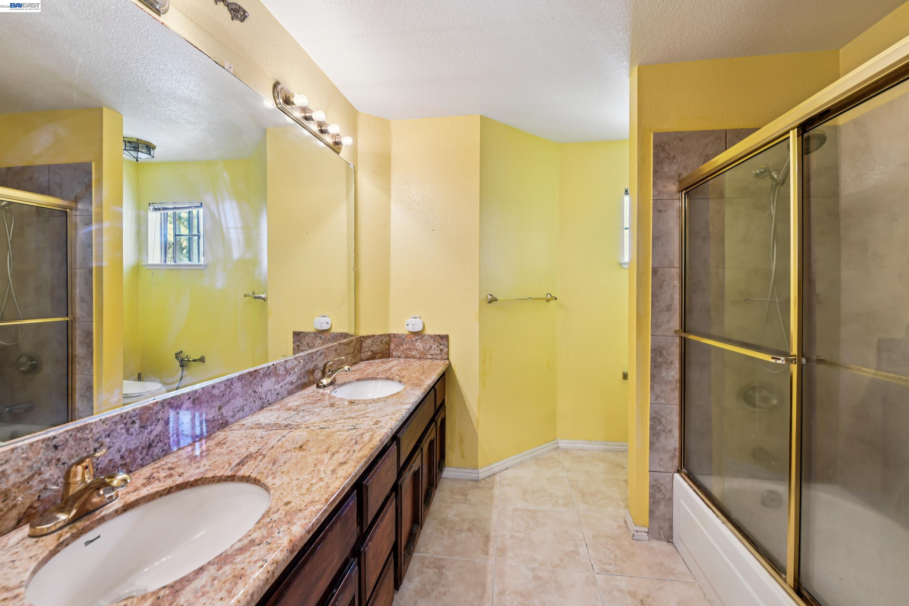 110 Conductor Way Folsom, CA 95630 - Photo 18 of 27 a bathroom with a granite countertop double vanity sink and a mirror